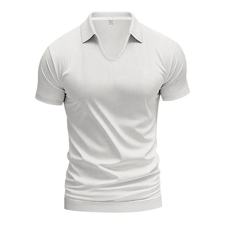 Man wearing a loose-fitting apricot V-neck short sleeve t-shirt against a plain background.
