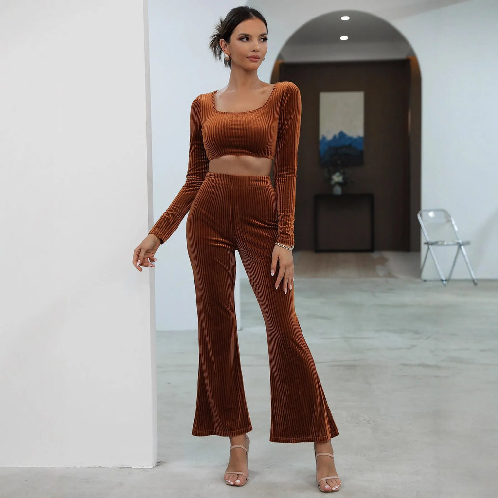 Caramel coloured long sleeve sweater and matching trousers loungewear set on a hanger