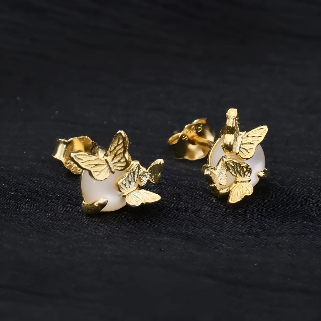 Butterfly ear studs in 925 silver with electroplated gold or white gold finish featuring zodiac modelling