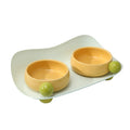 Ceramic raised pet feeder with two bowls in a pink yellow colour on a non-slip base.
