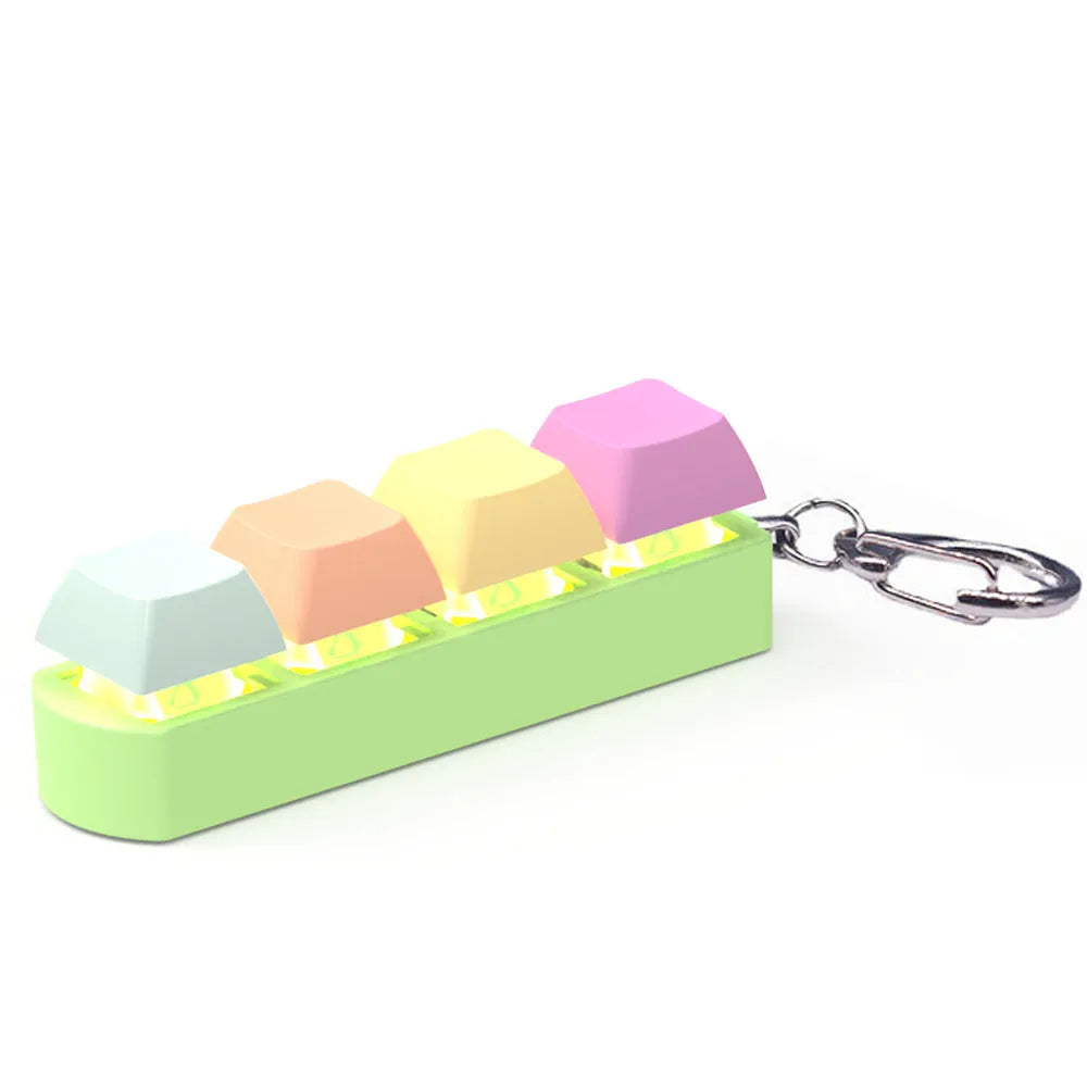 4-key mechanical shaft tester decompression toy with transparent bottom shell and coloured key caps.