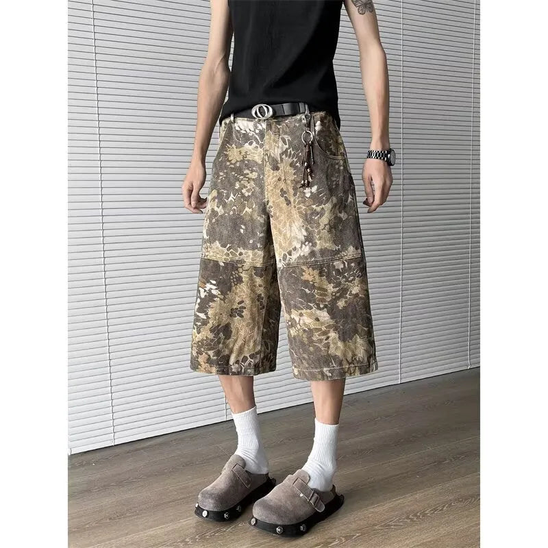 Yellow snake pattern camouflage cropped jeans showing detailed tooling print and denim construction