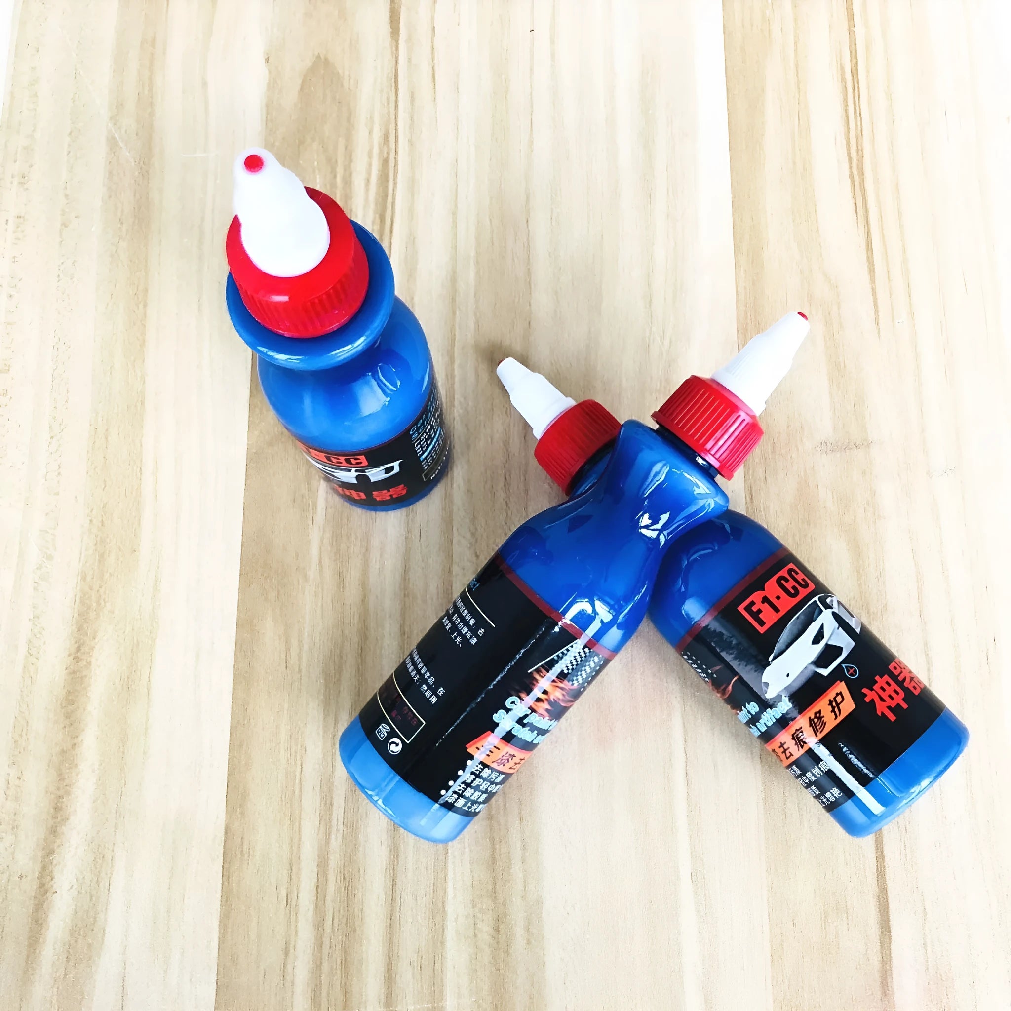 Car scratch repair agent with applicator brush for blue vehicle touch-ups