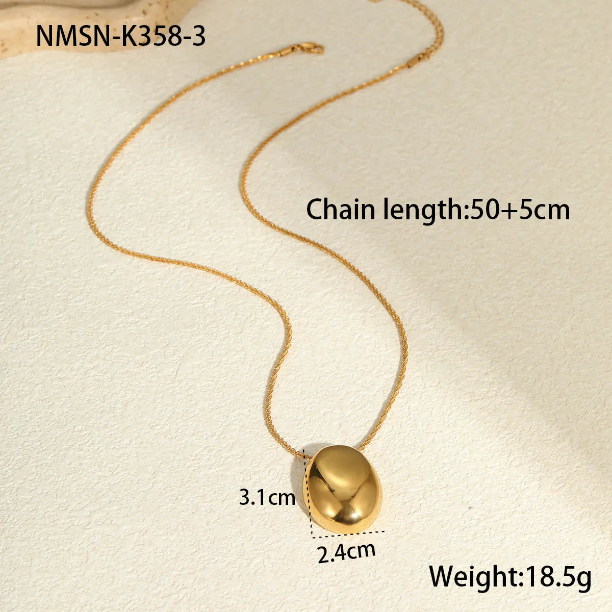 Gold geometric pendant on an adjustable stainless steel necklace chain.