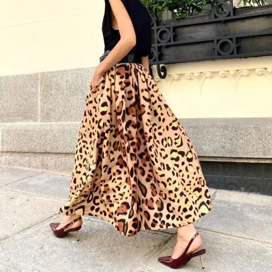 Brown leopard print women's A-line long skirt with elastic waistband laid flat.