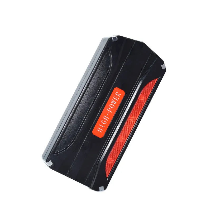 Black and red coloured 12V vehicle emergency jump starter power supply unit.