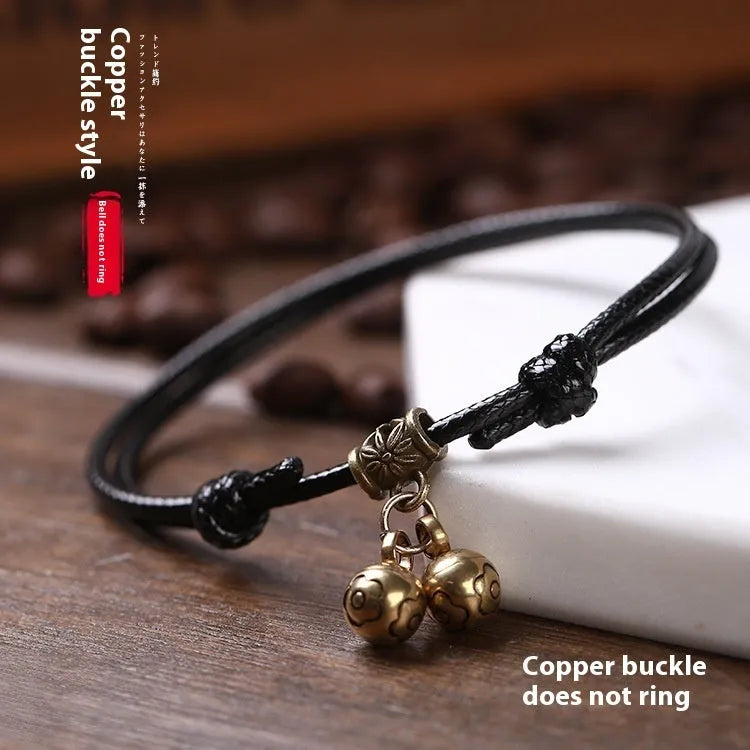 Adjustable nylon dog collar with brass bell in black rope for small to medium dogs