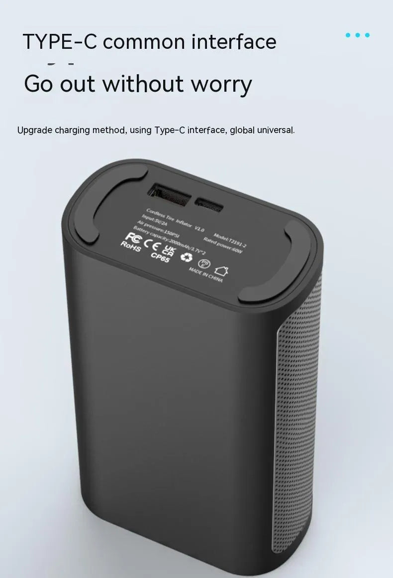 Handheld wireless digital display car tyre air pump with LED light and attachments on a grey background.