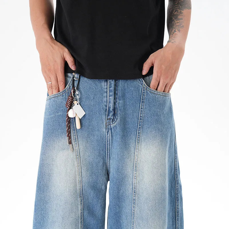 Light blue vintage washed wide leg machete jeans with zip fly on a model