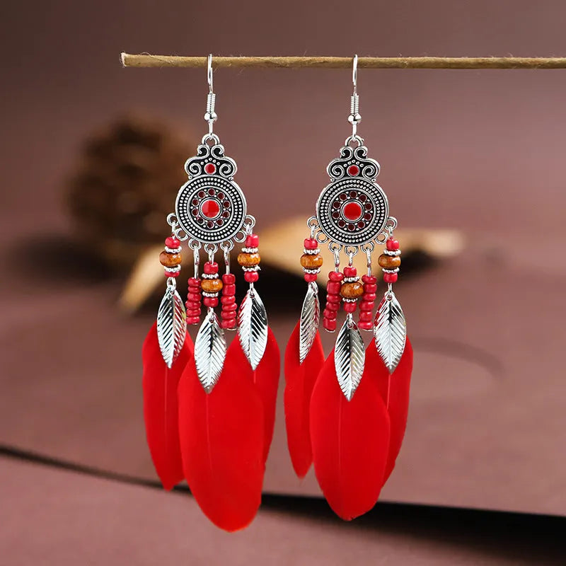 Round drop feather earrings in alloy with leaf shape and Bohemian patterning