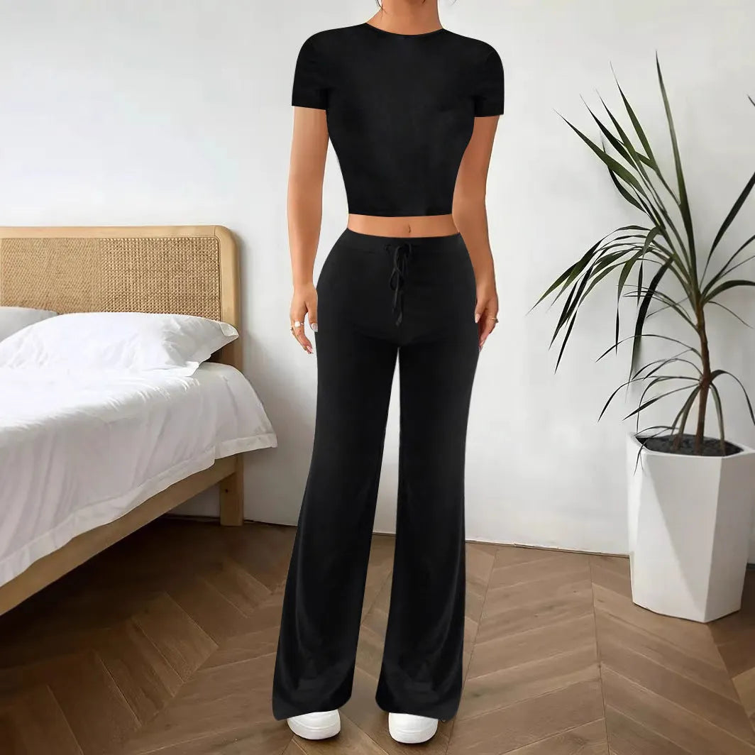Black high waist trousers and short sleeve t-shirt co-ord set on hanger