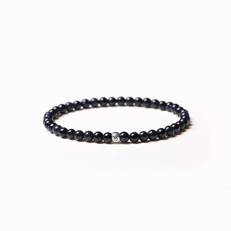Geometric unisex bracelet with black obsidian, blue san, and cut black agate 4mm beads.