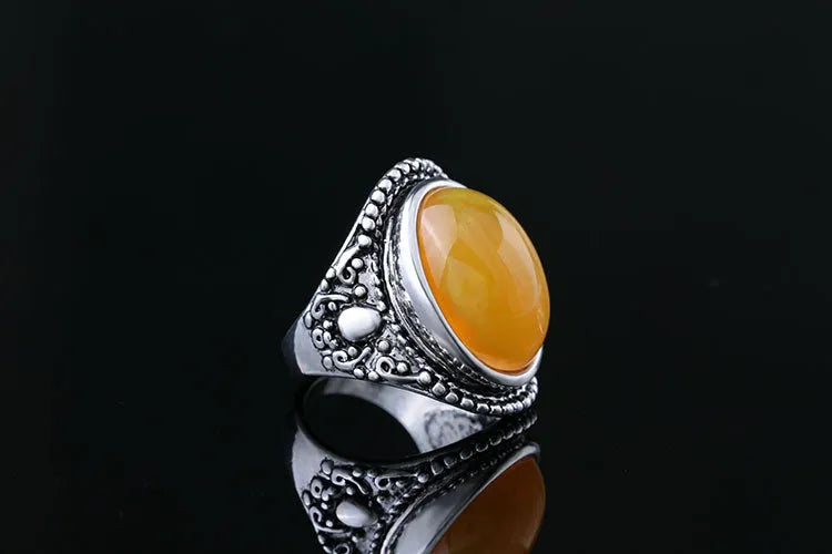 Geometric alloy ring with fluorescent beeswax plating in antique silver amber finish