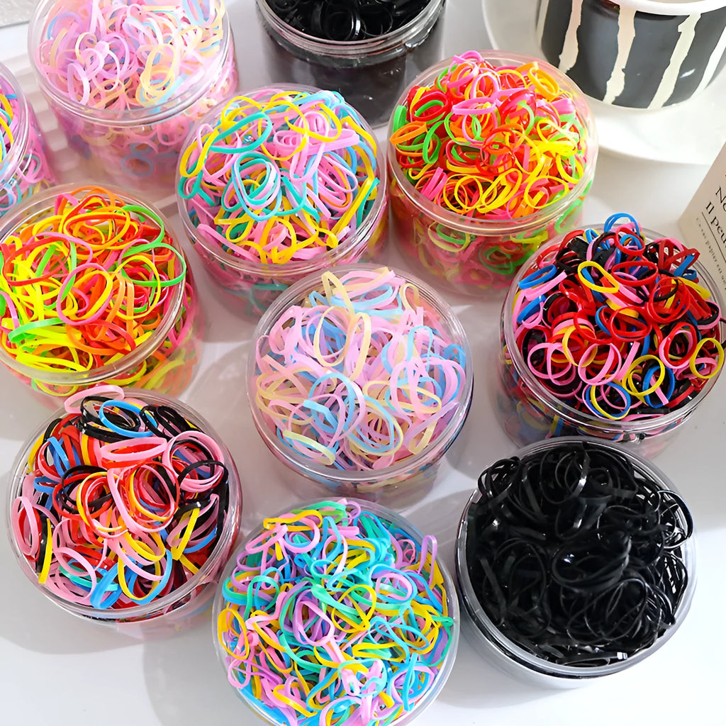 300 or 600 piece pack of baby hair ties in assorted colours, small TPU elastic bands for fine hair, supplied in a reusable container