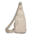 Soft PU women's crossbody bag in brown colour with open outer pocket and adjustable strap