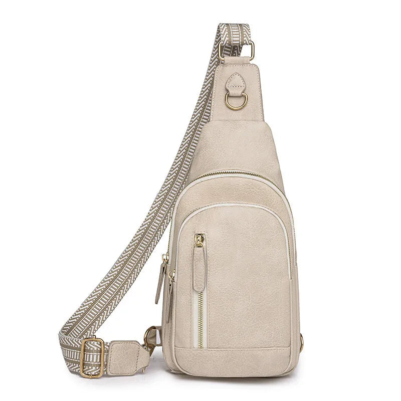 Soft PU women's crossbody bag in brown colour with open outer pocket and adjustable strap
