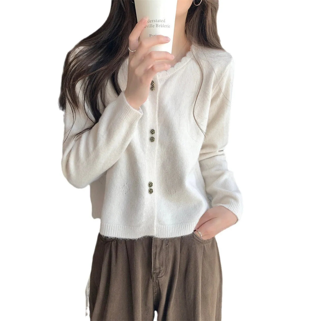 Women's long-sleeved acrylic cardigan coat in milky white, shown open as a lightweight knit layer.