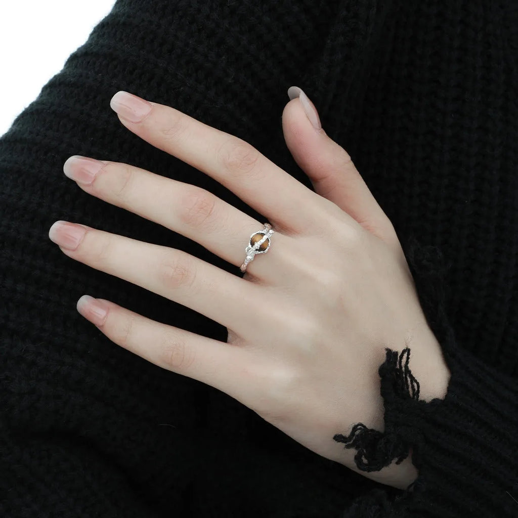 Women's Saturn design open ring with adjustable silver band and tigereye stone detail