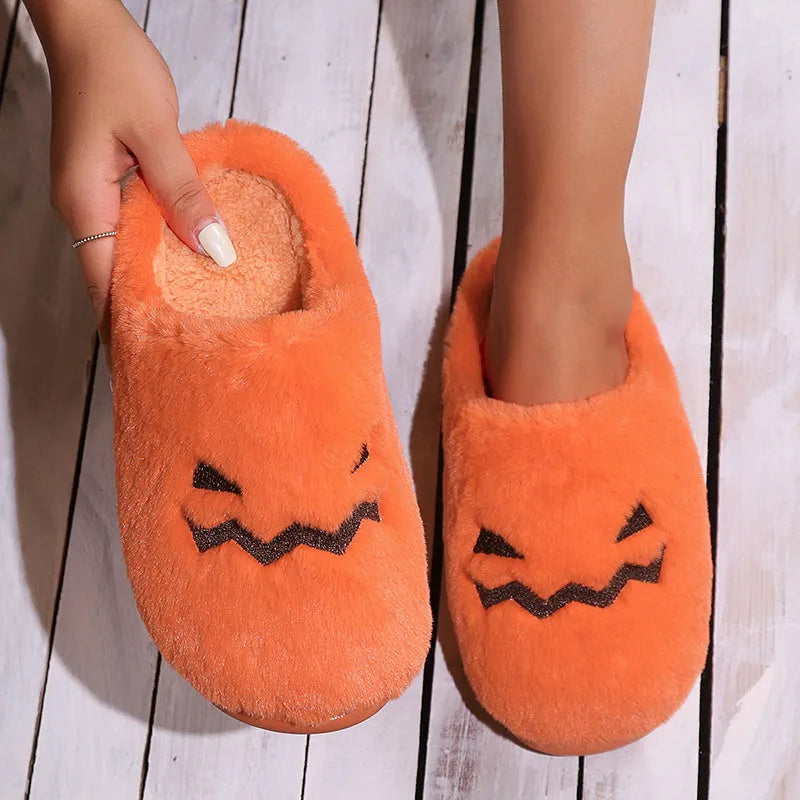 Orange Halloween pumpkin design plush slippers with coral velvet upper and flat PVC soles