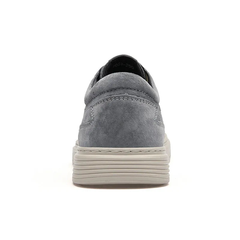 Men's grey low-top casual leather skate shoes with a round toe and flat rubber sole.