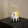 Handmade ceramic spherical ball headlight lamp on bedside table