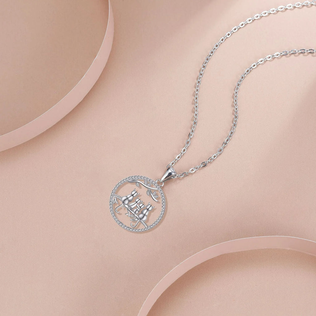 Copper Four Kitten Necklace with cross chain, electroplated finish, original cat design.