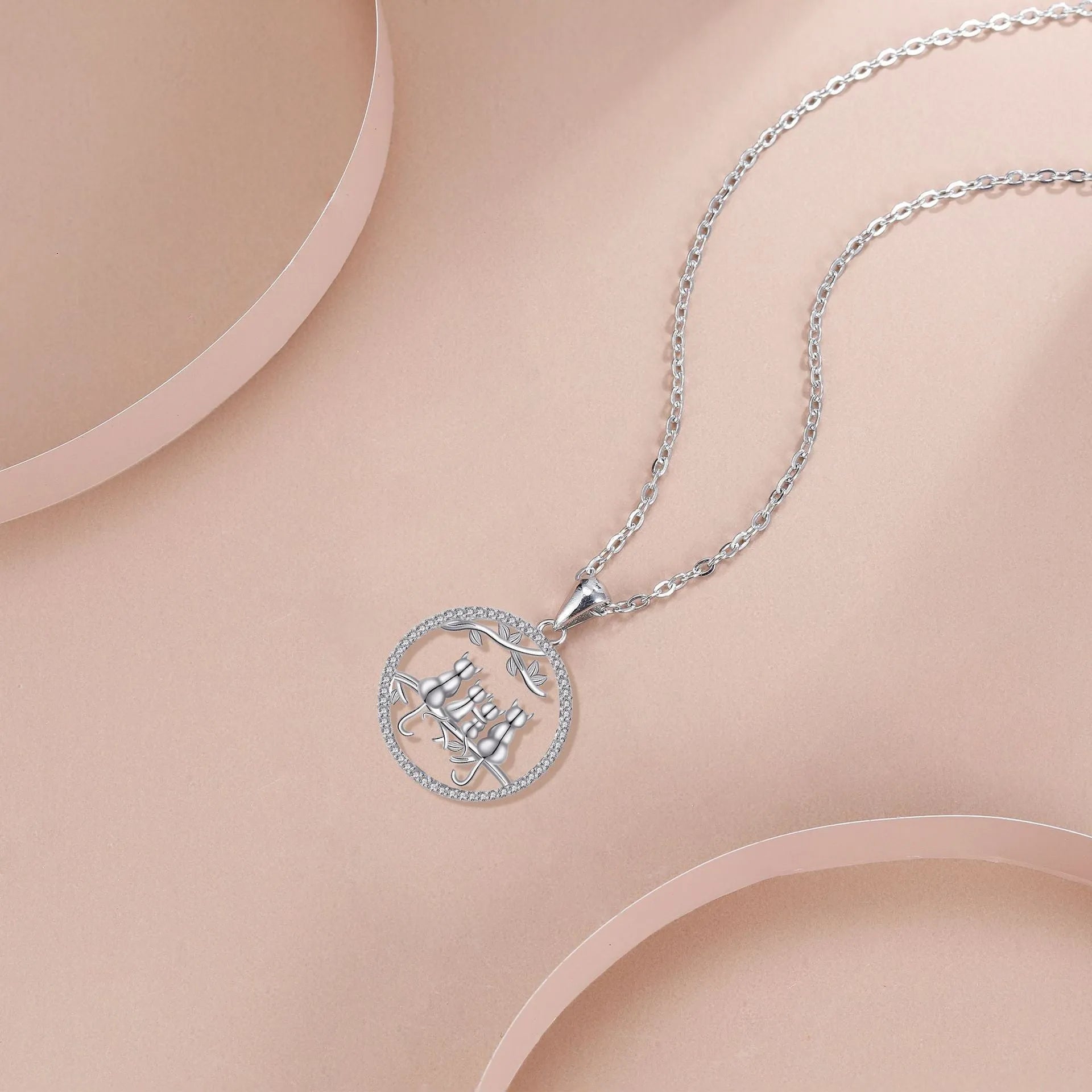 Copper Four Kitten Necklace with cross chain, electroplated finish, original cat design.