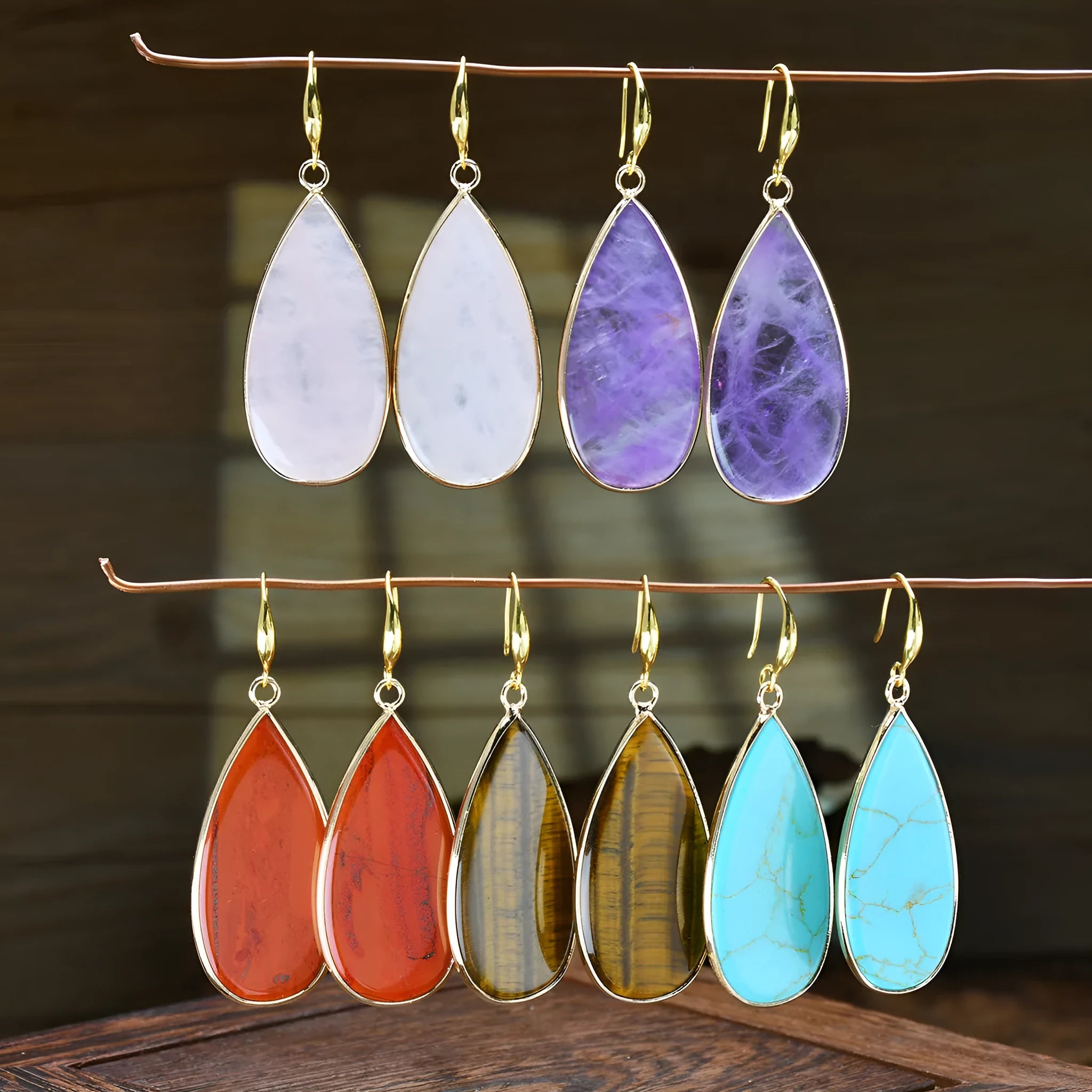 Vintage long water drop earrings in natural stone with textured surface and retro style