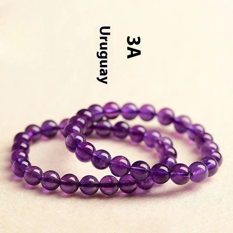 Natural Uruguay amethyst bracelet with scattered beads in four colour grades and eleven size options
