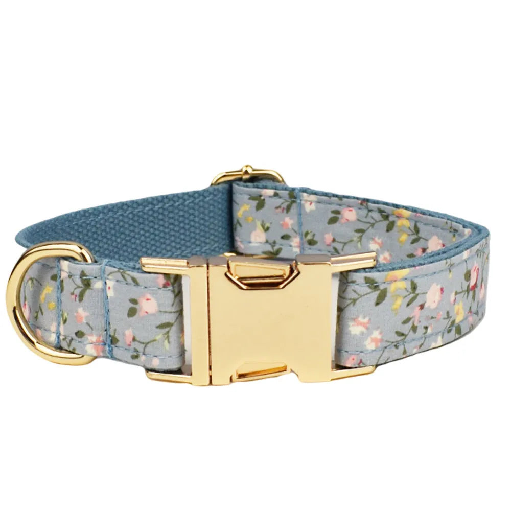 Blue floral polyester cotton dog collar set with matching leash, bow, vest, and poop bag accessories