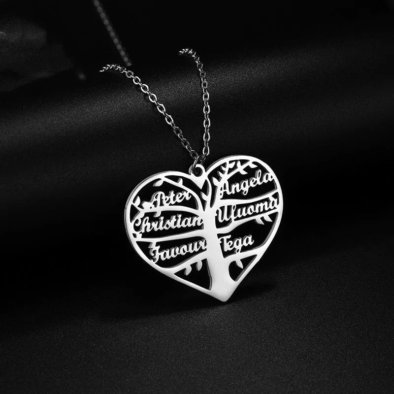 Personalised stainless steel necklace with a custom name pendant shaped as a tree inside a hollow heart on an adjustable chain.