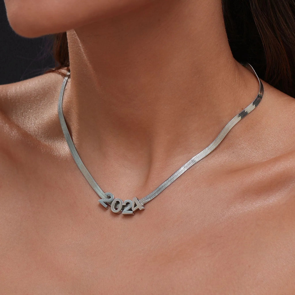 Gold electroplated titanium steel necklace with letter A charm on a 40.5cm blade chain