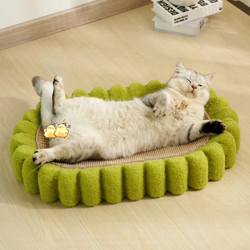 Green oval cat scratch pad and bed made from sisal measuring 650x420x100mm