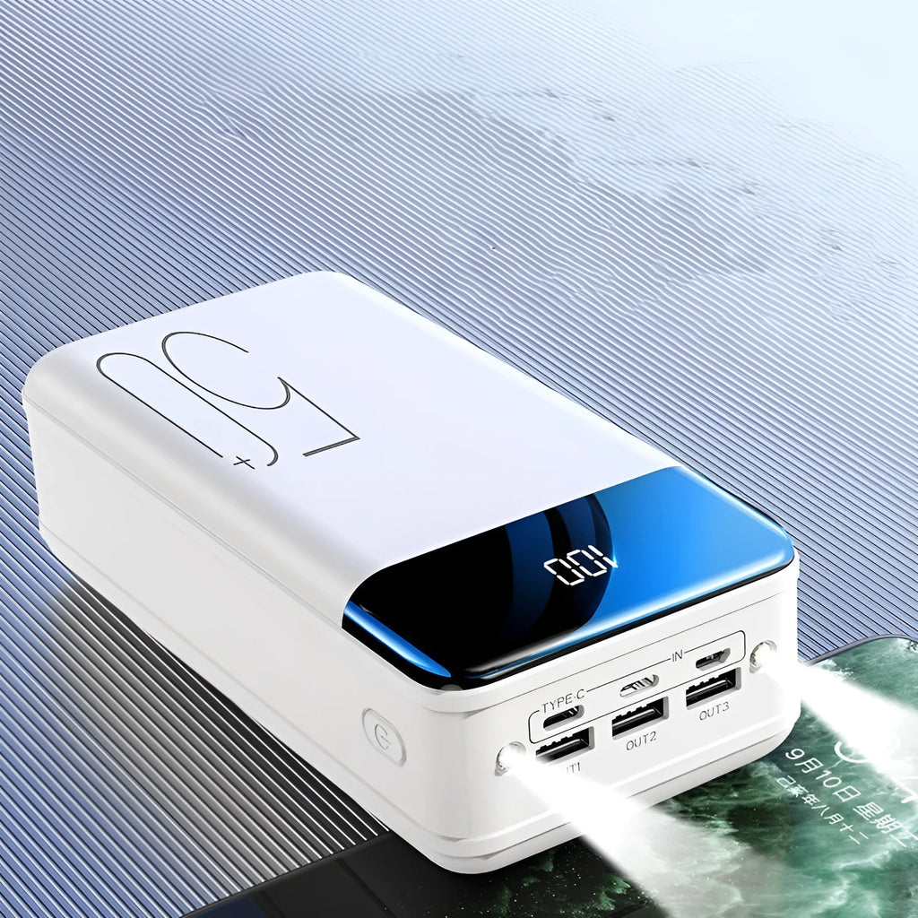 Large black power bank showing three output ports and display screen measuring 169mm