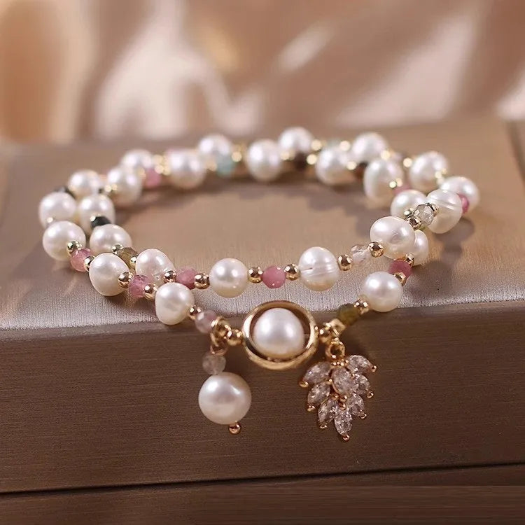 Women's double circle crystal bracelet with flower-shaped crystal detail in Strawberry Quartz colour