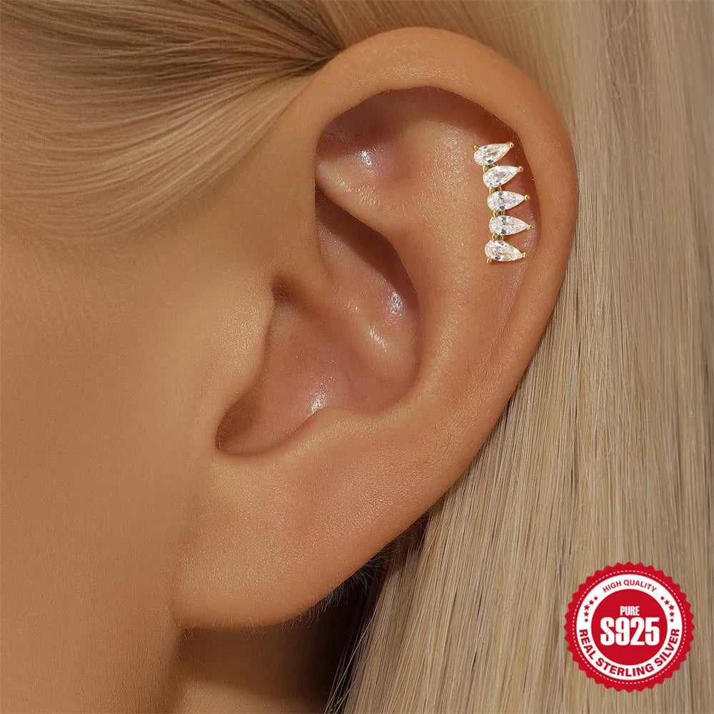 S925 sterling silver geometric stud earrings with moon shape and diamond-embedded star detail in a gold tone.