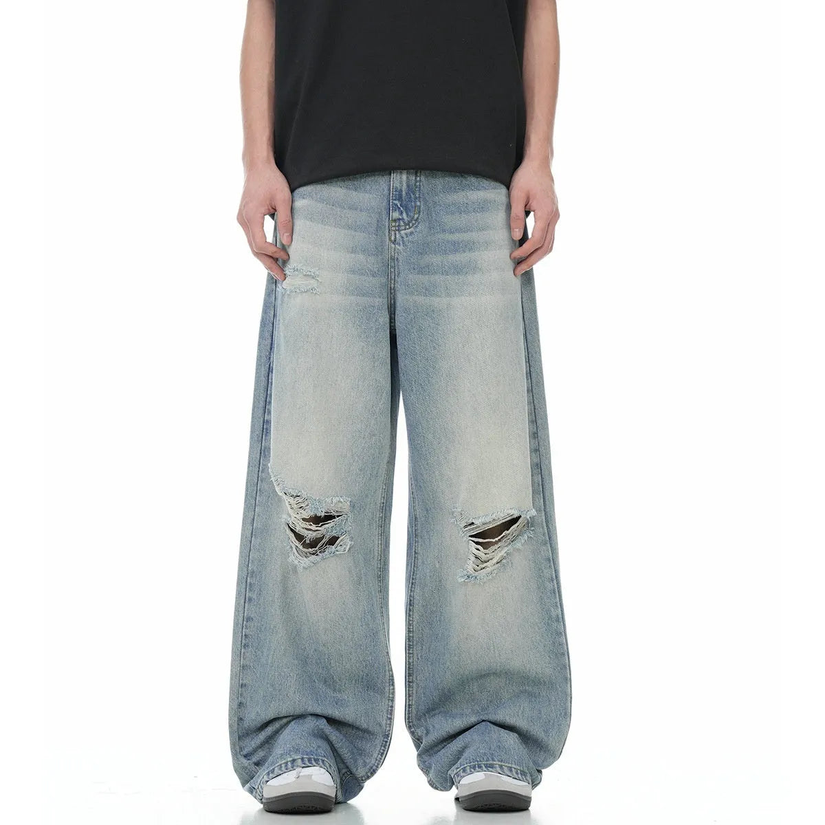 Blue men's retro straight-leg jeans with ripped details and a zipper fly.