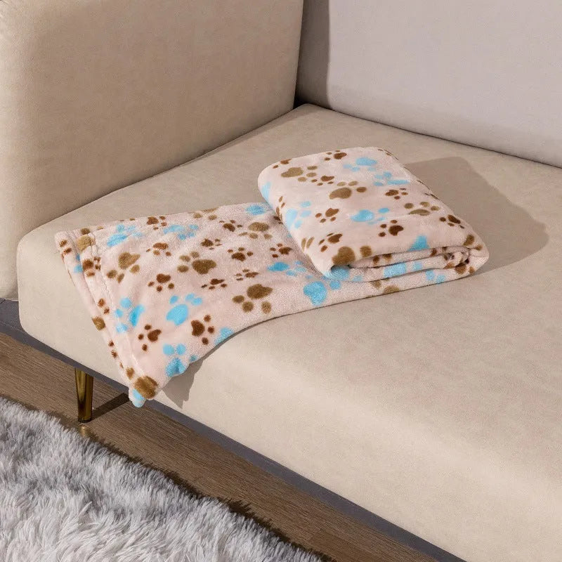 Blue dog cartoon pattern pet blanket laying flat, showing its double-sided thickened flannel texture.