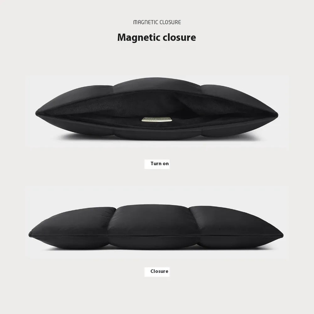 Soft black fluffy laptop sleeve case for a 15.6 inch laptop, showing sewing thread detail.