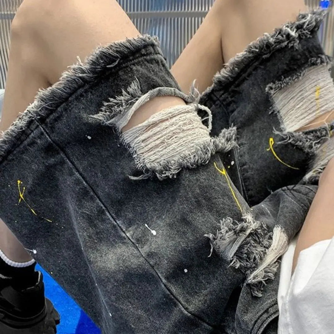 Men's distressed denim shorts with holes in light blue colour, loose fit above knee length