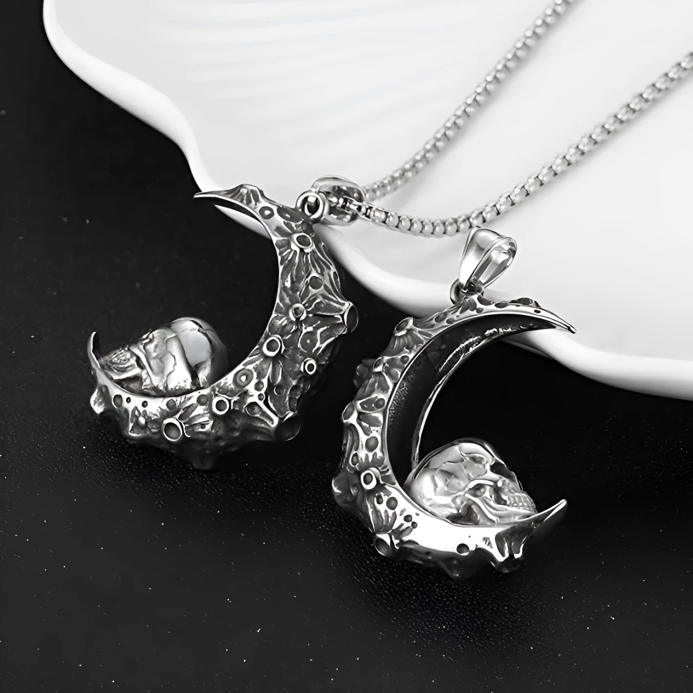 Men's silver skull pendant necklace on stainless steel chain, showing electroplated alloy pendant options.