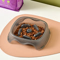 Dog slow feeder bowl with anti-choking maze pattern in BPA-free plastic available in four colours