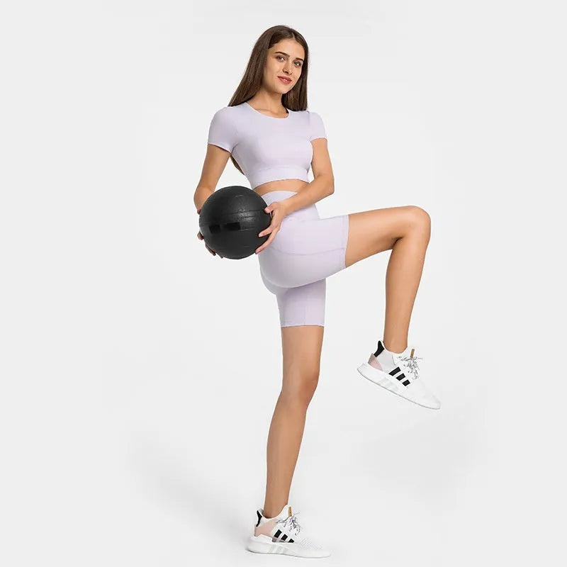 Women's tight black stretch sports shorts with cotton blend lining for running and fitness.