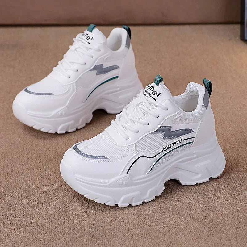 Women's white and beige breathable dad shoes with cross shoulder straps and a lace-up front.