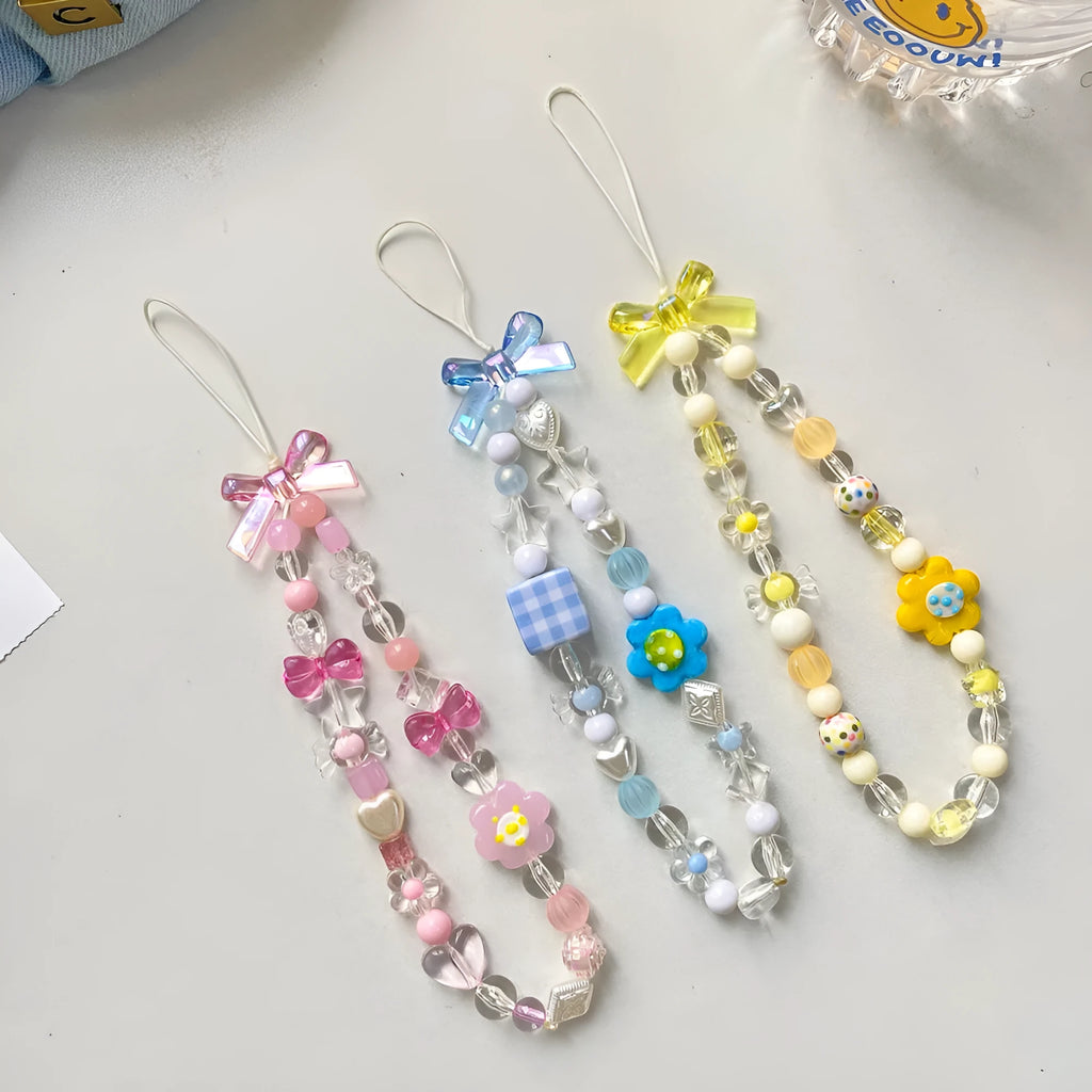 Beaded flower mobile phone lanyard with plastic resin decorative flowers and hand rope strap in blue colour