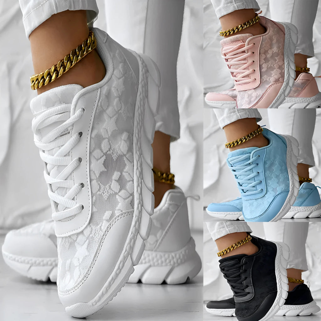 Women's casual canvas running shoes in white, black, blue, or pink with a flat heel and rounded toe.
