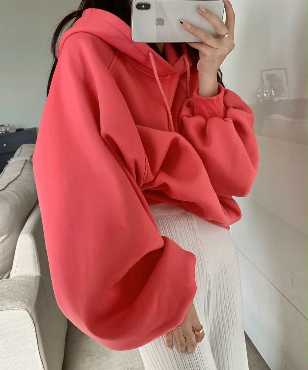 Watermelon red women's sleeveless hooded sweater in mulberry silk fabric on hanger