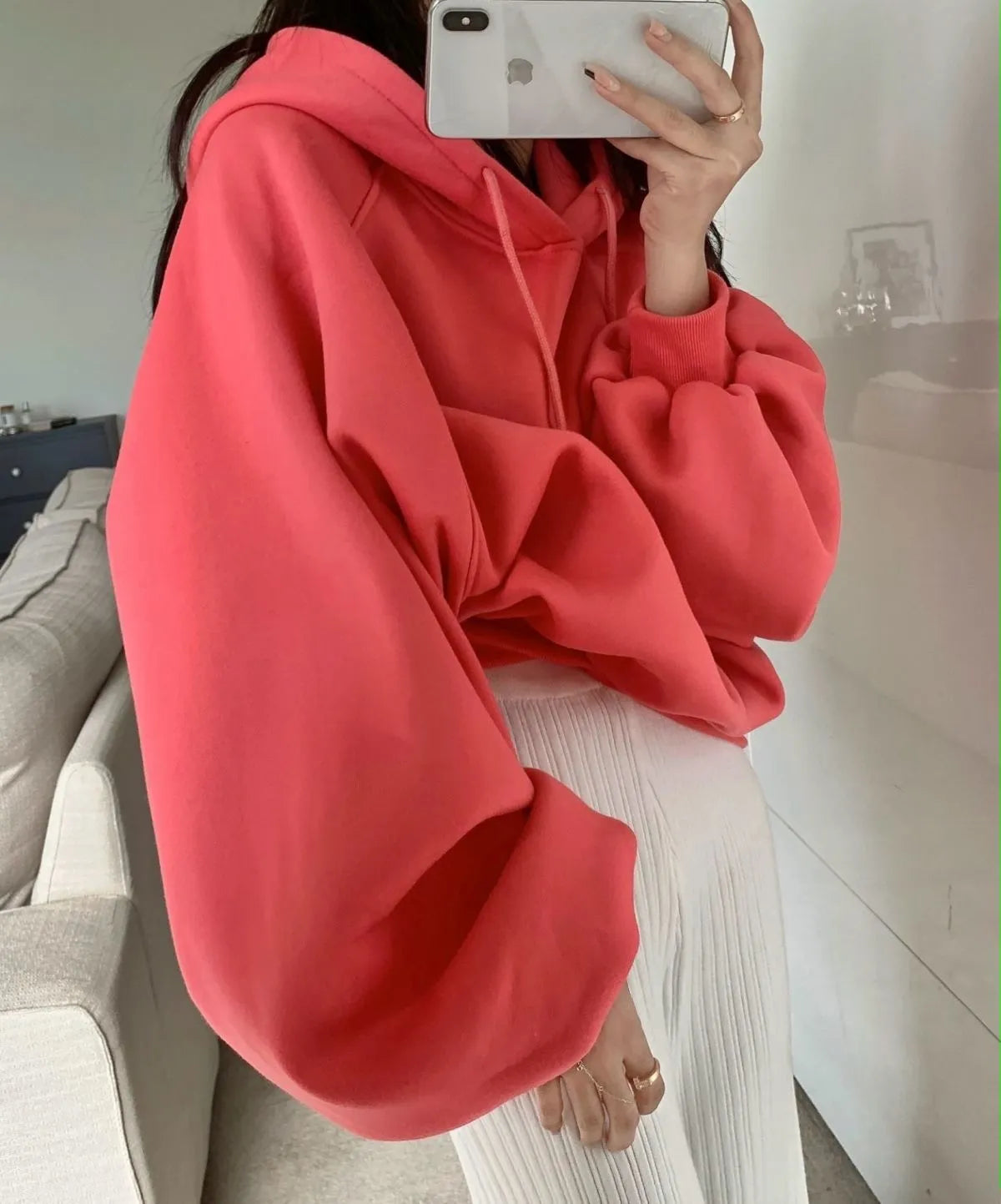 Watermelon red women's sleeveless hooded sweater in mulberry silk fabric on hanger
