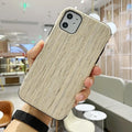 Wooden iPhone case showing rosewood, teak, and walnut finish options on compatible iPhone models