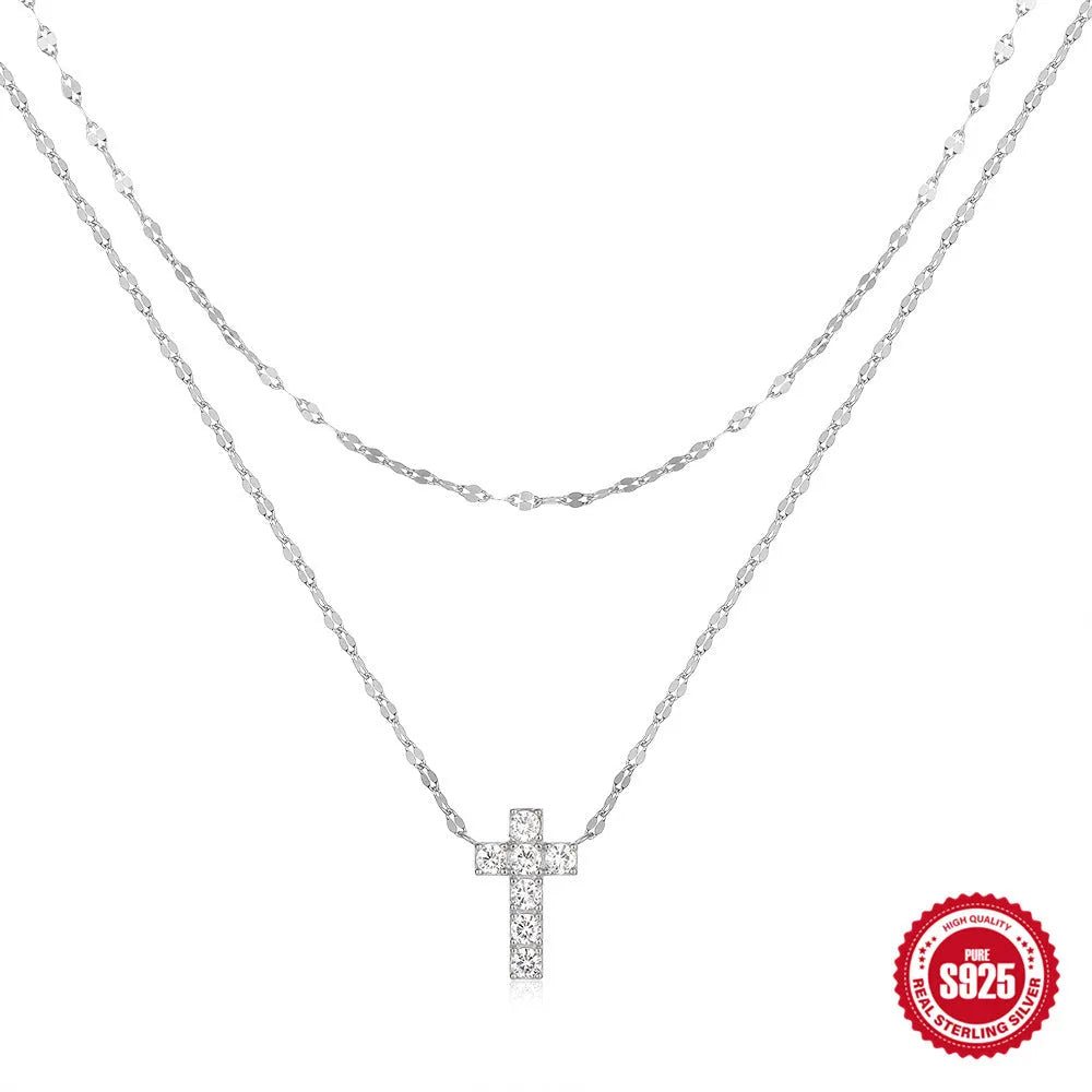 Sterling silver double layer twin diamond cross pendant on a clavicle chain.